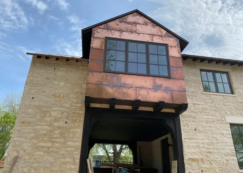 Copper metal panel facade on a stone building for Roof Repair in West Rancho Dominguez